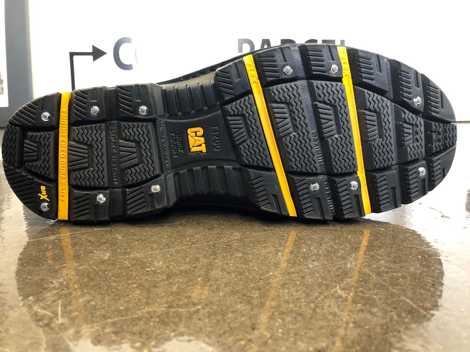 Official iGrip CAT outsole photograph with six heel and six forefoot stud positions